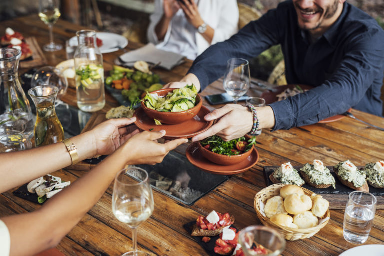 People Holding Bowl With Salad