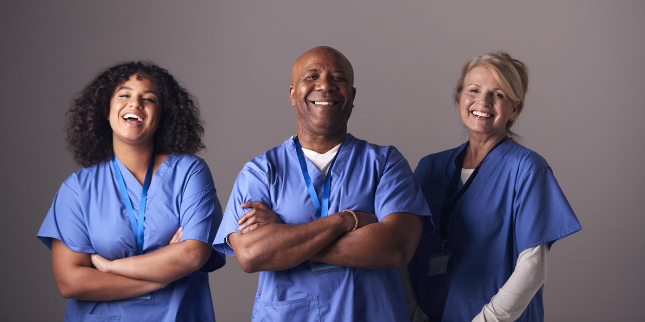 three smiling nurses