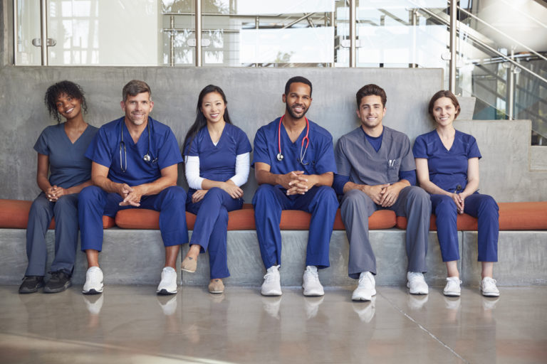 Healthcare workers sitting in a modern hospital, low angle