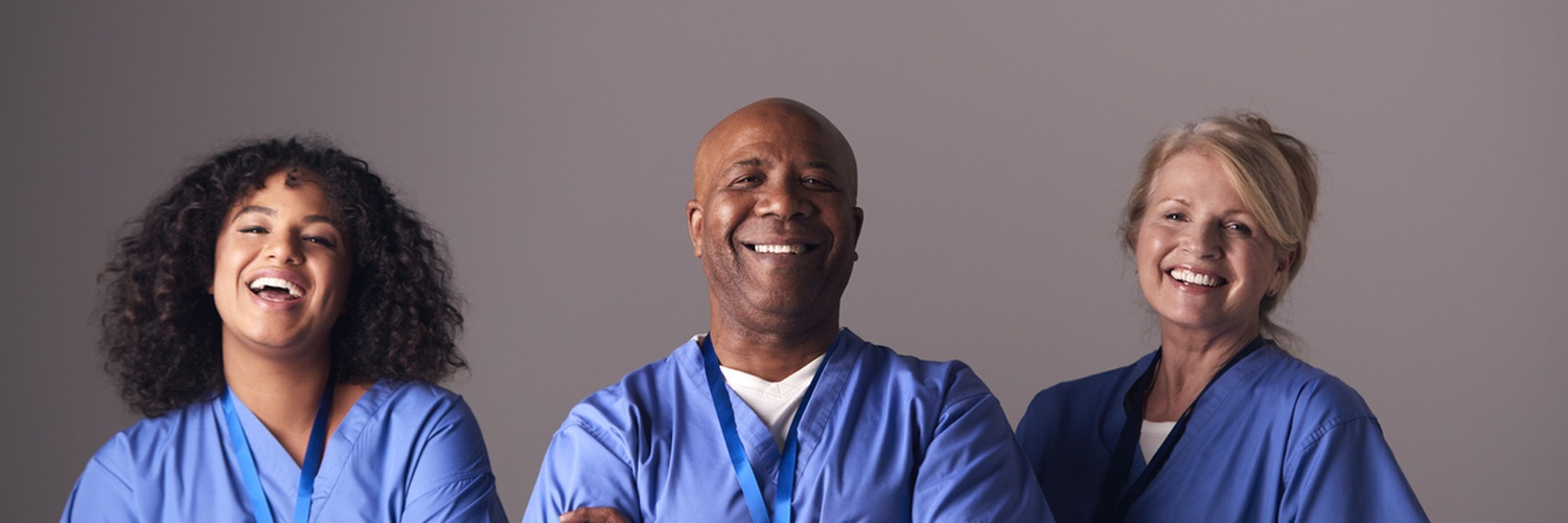 Three smiling healthcare workers