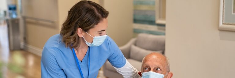 smiling nurse helping the patient