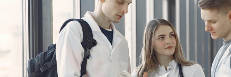Group of Medical Students at the Hallway Sharing Notes