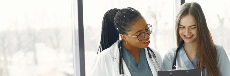 Healthcare Professionals Looking at the Document on the Clipboard