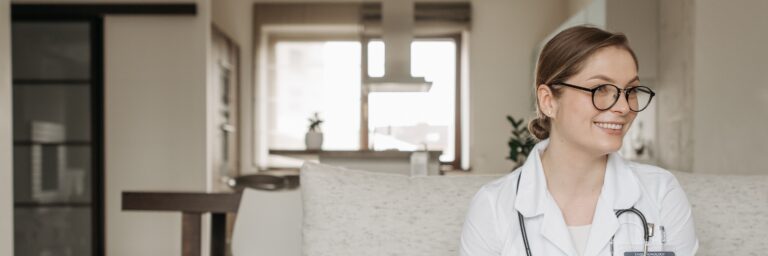 Medical Professional Sitting on a Sofa